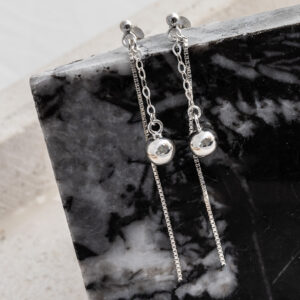 Sterling Silver Round Box and Ball Studs on a black marble tile background.