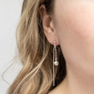 Sterling Silver Round Box and Ball Studs worn by a model.
