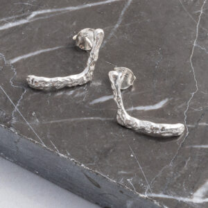 Sterling Silver Molten Studs on a grey marble title background.