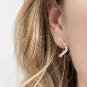 Sterling Silver Molten Studs worn by a model.