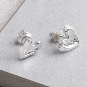 Sterling Silver Molten Heart Studs on a white background.