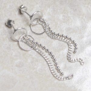 Sterling Silver Curb and Bead Dangly Studs on stone background