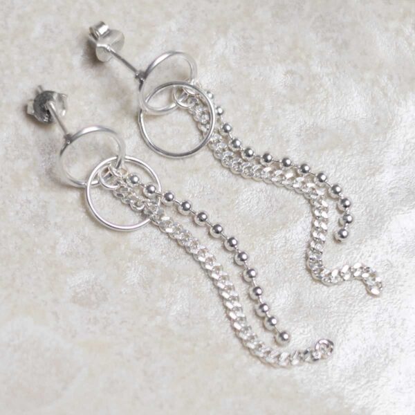 Sterling Silver Curb and Bead Dangly Studs on stone background