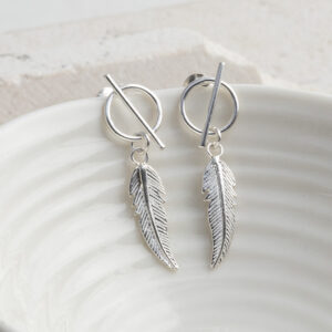 Sterling Silver Bar and Feather Studs on a white cup background.