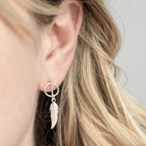 Sterling Silver Bar and Feather Studs on a model.