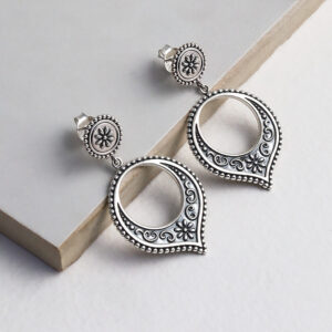 Sterling silver Harbala dangly stud earrings featuring Moroccan design with elegant hoop drop detailing on a grey title.