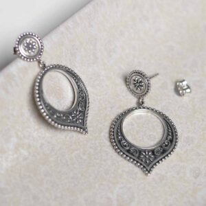 Sterling Silver Harbala Dangly Studs on stone background