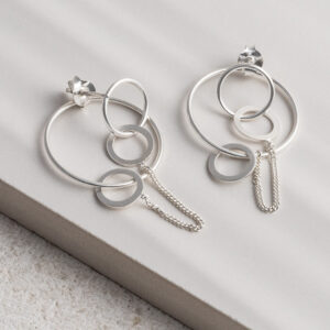 Sterling Silver Two Way Circle Studs on a white tile background.