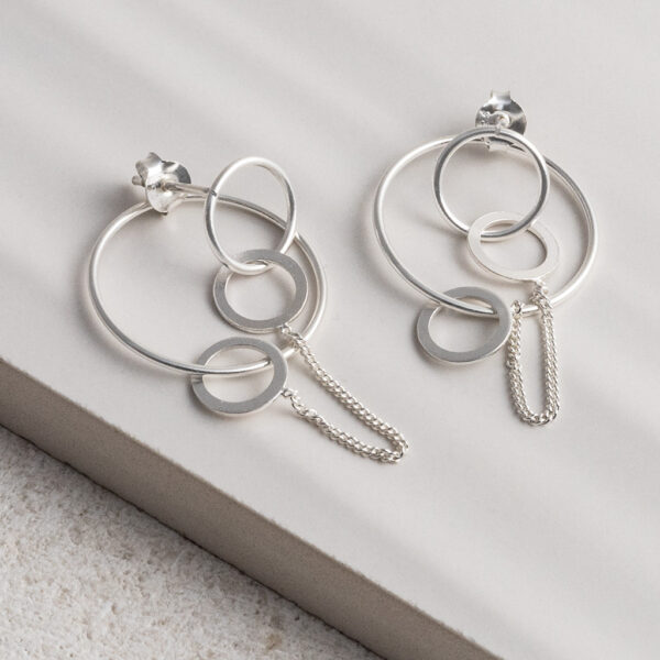 Sterling Silver Two Way Circle Studs on a white tile background.