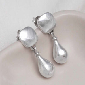 Sterling Silver Rain Droplet Studs on jewellery dish