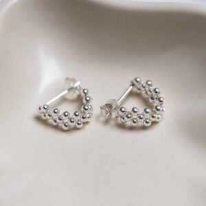 Sterling Silver Triple Swinging Bead Studs in jewellery dish