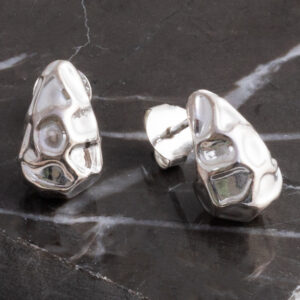 Sterling Silver Molten Drop Studs on grey marble background.