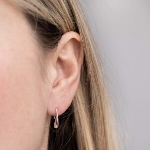 Sterling Silver Mini Liquid Drop Earrings worn by a model.