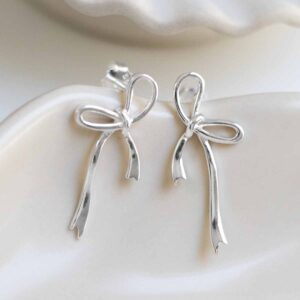 Sterling Silver Ribbon Bow Studs on jewellery dish