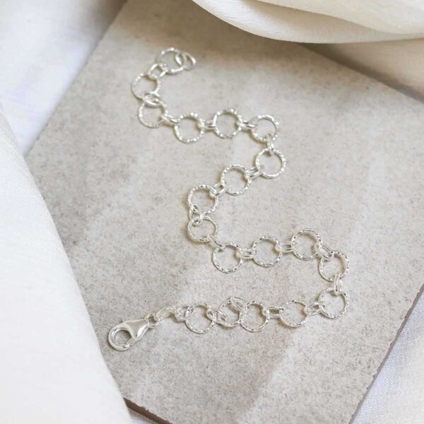 Sterling Silver Shimmer Link Bracelet on stone background
