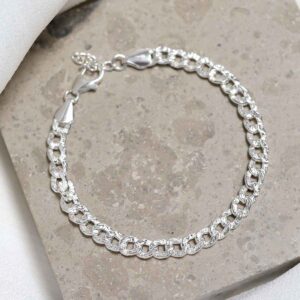 Sterling Silver Hammered Cuban Bracelet on stone