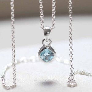 Sterling Silver Blue Topaz Birthstone Necklace hanging