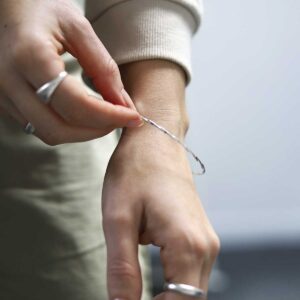Sterling Silver Fine Twisted Bangle worn by model