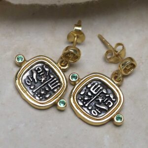 Gold Plated Sterling Silver Hieroglyphics Square Earrings on cream fabric background.