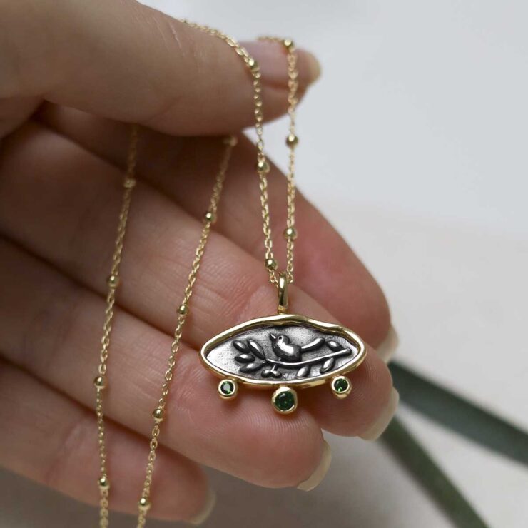 Gold Plated Sterling Silver Hieroglyphics Necklace showing size with necklace on palm of hand.