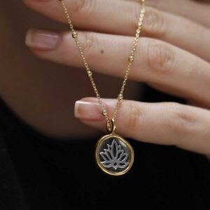 Gold Plated Sterling Silver Lotus Necklace worn by model wearing a black t shirt.