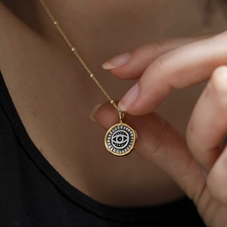 Gold Plated Sterling Silver Evil Eye Round Necklace worn by a model with black tshirt.