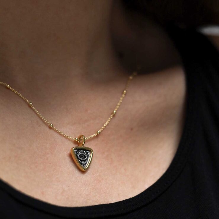 Gold Plated Sterling Silver Evil Eye Necklace worn by model with black t shirt