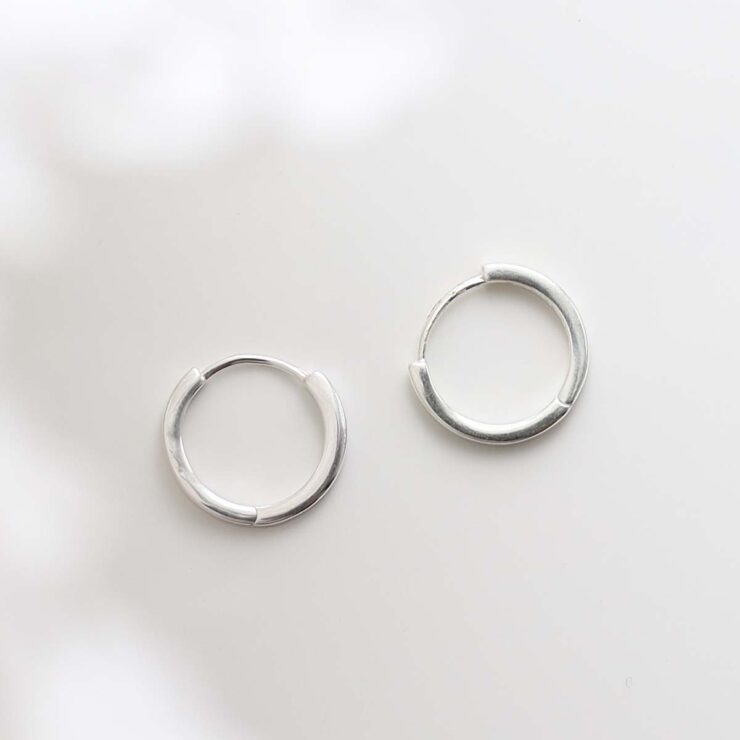 Sterling Silver Flat Huggies on white