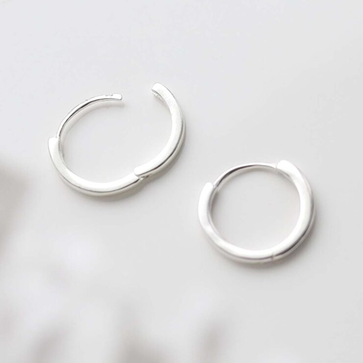 Sterling Silver Flat Huggies on white