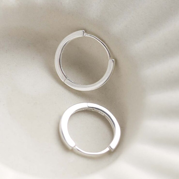 Sterling Silver Flat Huggies in trinket dish