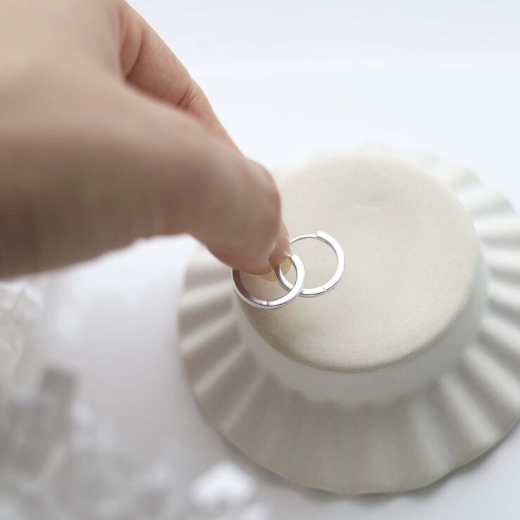 Sterling Silver Flat Huggies in trinket dish